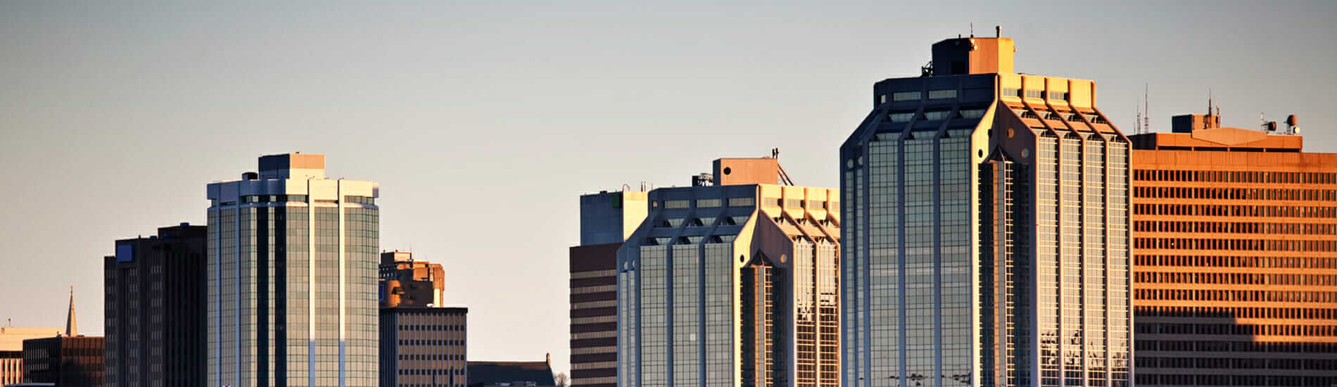 Halifax downtown skyline with modern glass office towers at sunset