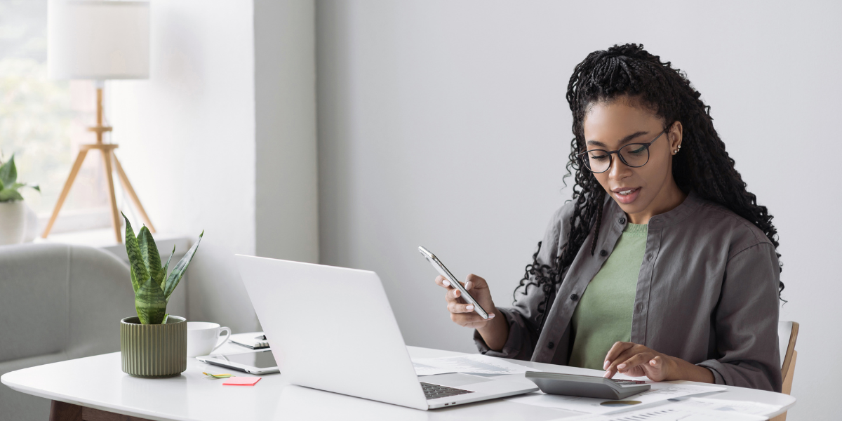 A smiling payroll supervisor confidently handling finances—showcasing the career opportunities available when you start your accounting training.