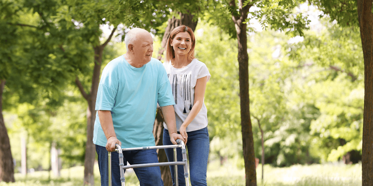 A dedicated community support worker helping an elderly person, showcasing the compassionate side of a community support services career.