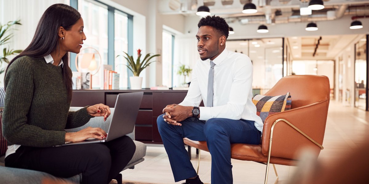A candidate asking insightful questions about company culture and long-term vision during a job interview.