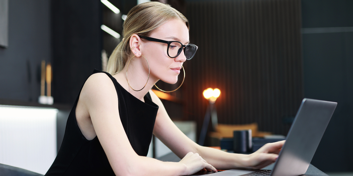 A professional woman wearing a sleek black dress, exuding authority and sophistication for a high-level job interview.