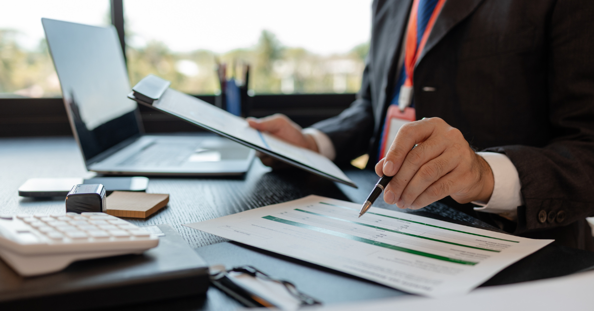 Bookkeeper working on laptop using cloud accounting software to manage financial records